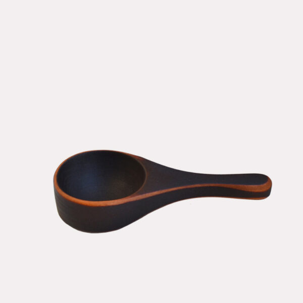 This image shows the 5 inch coffee scoop in flame blackened cherry.