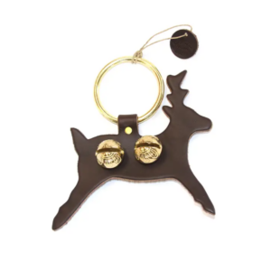 Leather dark brown reindeer with two brass sleigh bells attached. The leather hangs from a brass ring that can be hung on a door knob.